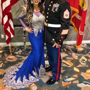 Royal blue long sleeve mesh bodice mermaid gown with gold embroidered accents